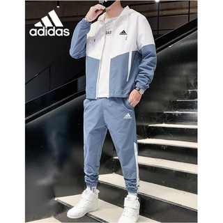 Adidas ของแท้ 100% เสื้อโค้ท กันลม พิมพ์ลาย Colorblock และกางเกงวอร์ม แฟชั่นสําหรับผู้ชาย