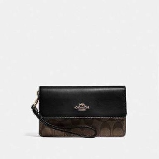 COACH  FOLDOVER WRISTLET IN SIGNATURE CANVAS