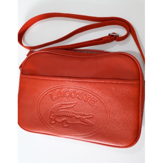 กระเป๋าสะพายสีแดงLacosteแท้100%