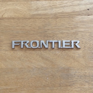 โลโก้ FRONTIER ตัวหนังสือฝาท้าย