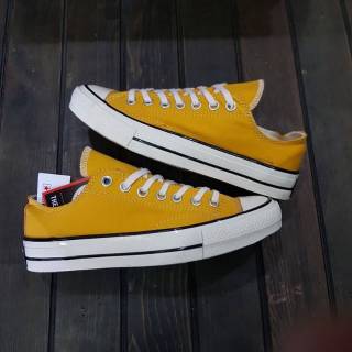 Converse 70s รองเท้าผ้าใบลําลองสําหรับเด็ก unisex สีเหลือง ลายดอกทานตะวัน