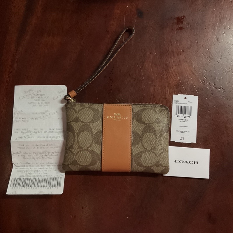 Coachแท้คล้องมือลายซีคาดส้มไซส์S(ส่งฟรี)