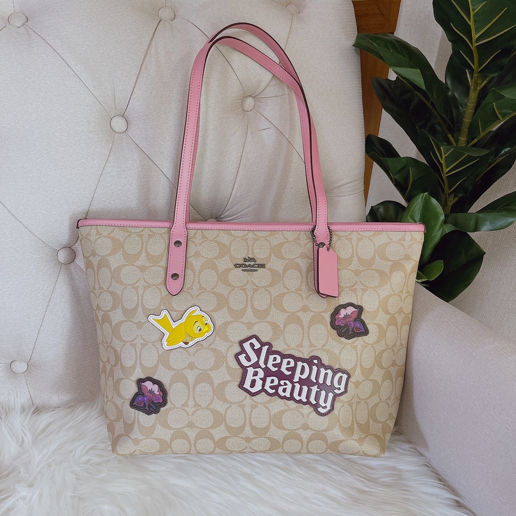 DISNEY X COACH CITY ZIP TOTE IN SIGNATURE CANVAS WITH SLEEPING BEAUTY (COACH F73359)