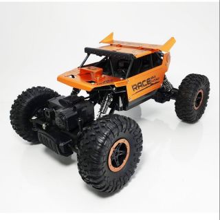 รถไต่หินบังคับวิทยุ MONSTER ROCK CRAWLER ตัวรถสวยงามมาก มีสปอยเลอร์หลัง  อัตราส่วน 1:18 – JD TOYS – 699-107 (สีส้ม)