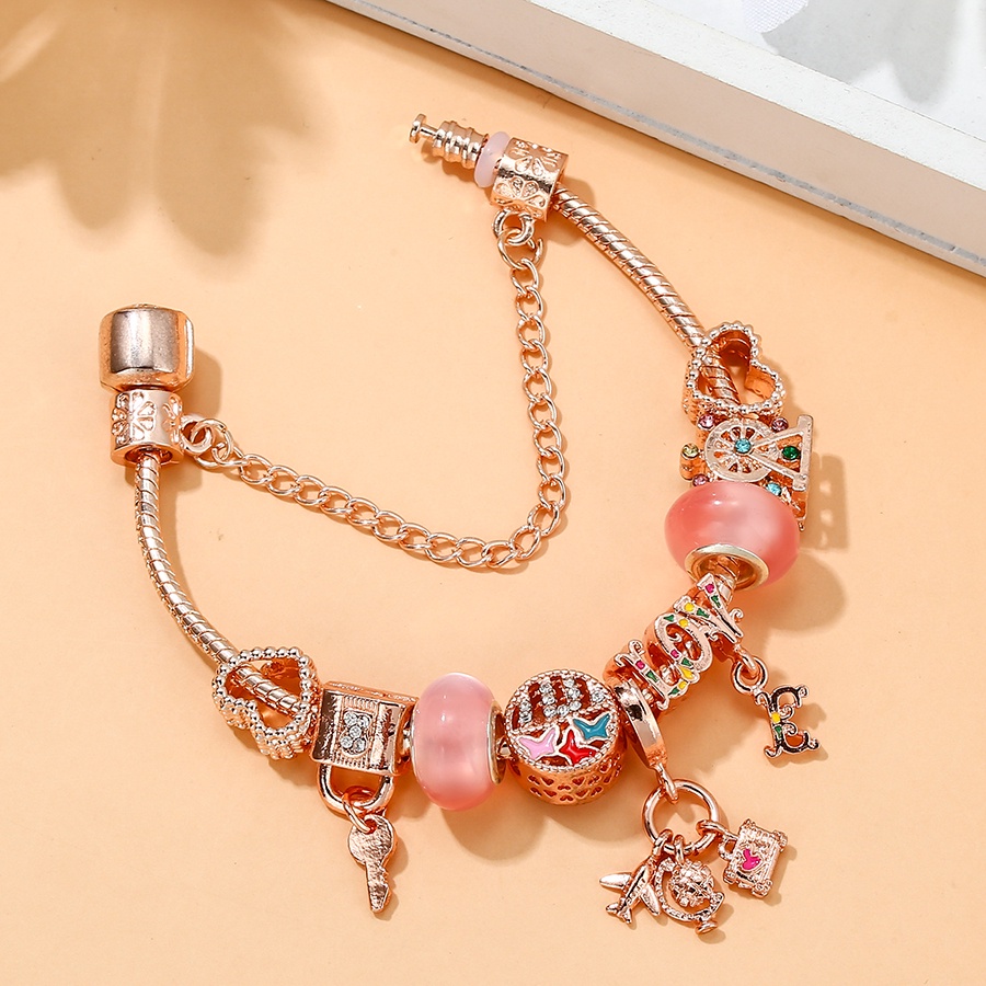 Dinglly โรสโกลด์ เครื่องบิน และกระเป๋าเดินทาง จี้ผีเสื้อ รัก ลูกปัด หัวใจ ล็อค & พวงกุญแจ จี้ สร้อยข้อมือ สําหรับผู้หญิง กําไลข้อมือคริสตัล สีชมพู
