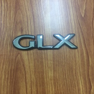 โลโก้* GLX สีเงินขอบดำ  ขนาด* 2.5 x 10.2 cm