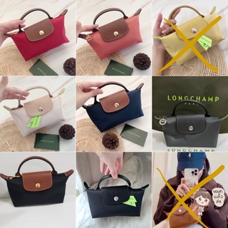 (หายากมากๆ)เล็กนะคะ Longchamp Le Pliage Pouch With Handle สอบถามก่อนสั่งนะคะบางสีหมดค่ะ