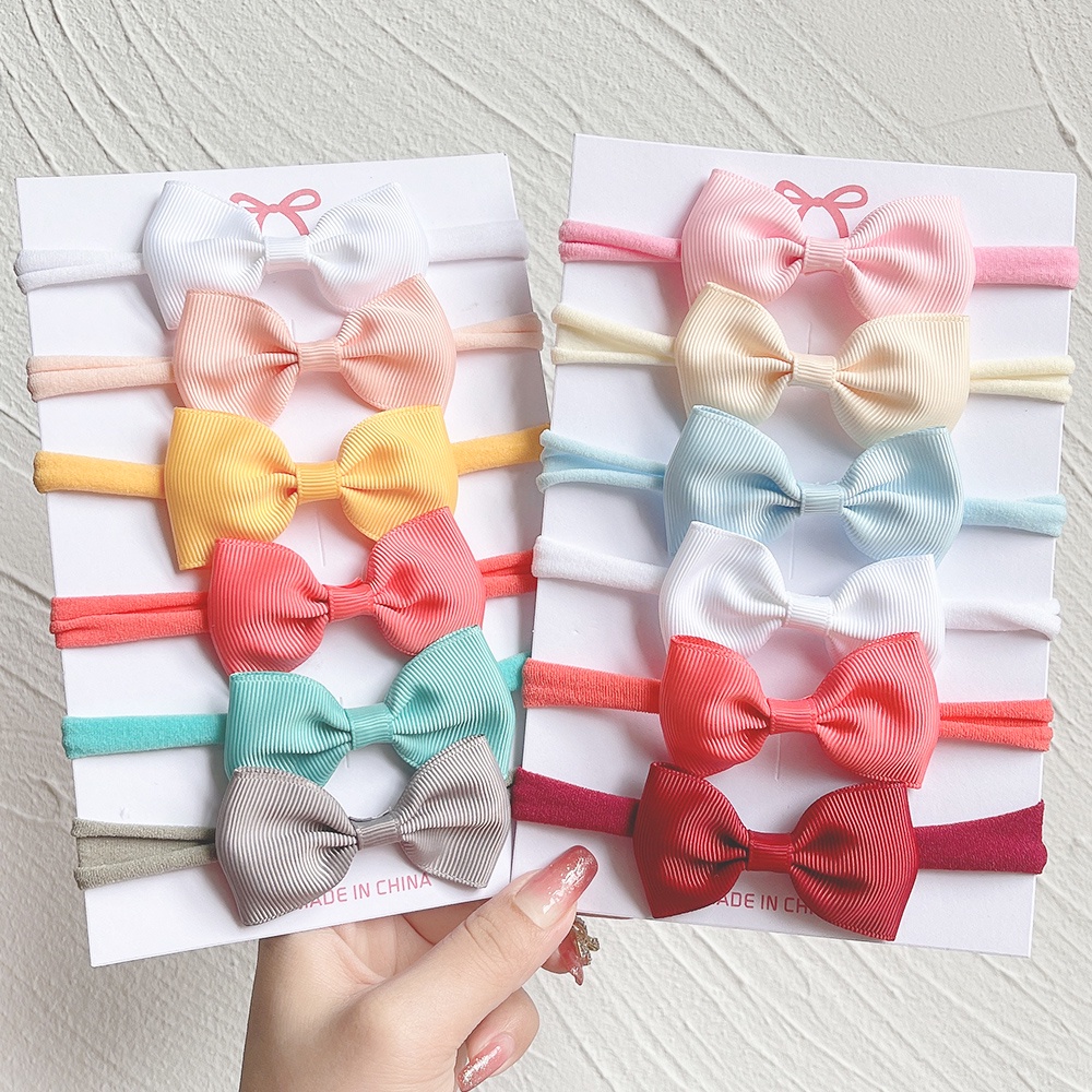 6 ชิ้น / ชุดน่ารักทึบโบว์เด็กผู้หญิงผ้าคาดศีรษะริบบิ้นผ้าไนลอน