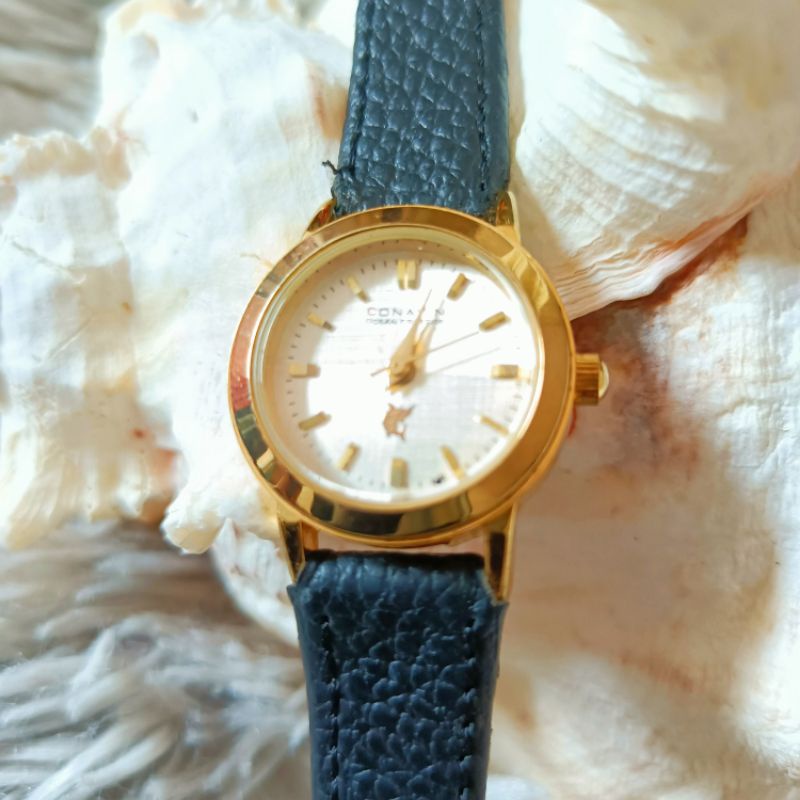 นาฬิกาแบรนด์เนมCONAVIN OCEAN PRESTIGEหน้าปัดสีทองตัวเรือนสีทอง สายหนังสีดำของแท้ 100% มือสองสภาพสวย