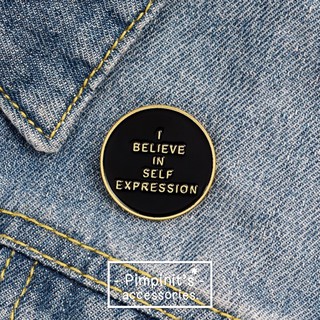 🇹🇭 พร้อมส่ง : เข็มกลัดวงกลมสีดำ | "I BELIEVE IN SELF EXPRESSION" Black Round Enamel Brooch Pin.