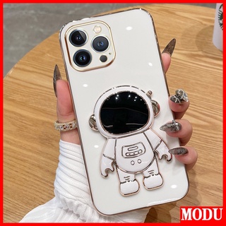 Modu เคสโทรศัพท์มือถือชุบไฟฟ้า ลายนักบินอวกาศ หรูหรา พร้อมขาตั้ง สีมาการอง สําหรับ Apple IPhone 11 Pro Max 12 Mini 12 Pro Max