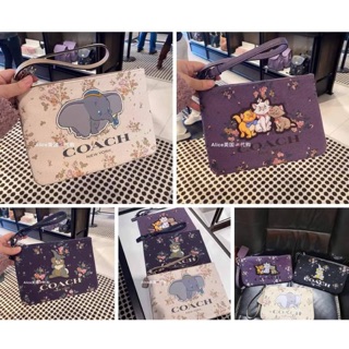 กระเป๋าคลัช Dumbo X Coach แบบมีสายคล้องมือ มี 3 แบบ ตามภาพ