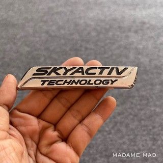 โลโก้ MAZDA SKYCTIV TECHNOLOGY สีเงิน ขนาด 11.2x2.2cm