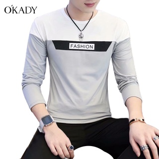 OKADY ฤดูใบไม้ผลิและฤดูใบไม้ร่วงใหม่เสื้อยืดแขนยาวผู้ชายเกาหลีพิมพ์บางพอดีแนวโน้มลำลองเย็บเสื้อด้านล่าง