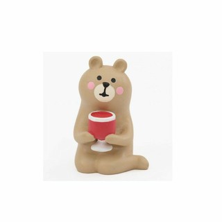 Cute brown sitting bear with drink figure.