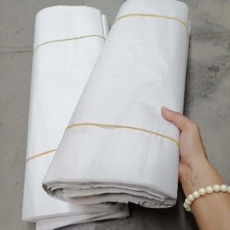 กระดาษ​ขาว หน้ากว้าง (ใช้ปูโต๊ะ​/ซับน้ำมันของทอด)​