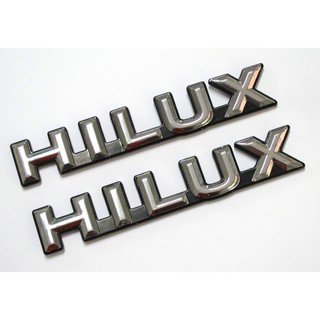 (2ชิ้น) HILUX LOGO แผ่นป้ายโตโยต้า สีชุบพื้นดำ สำหรับรถโตโยต้าทุกรุ่น วีโก้ ไทเกอร์ ไมตี้ ฮีโร่ TOYOTA HILUX 1984-2015