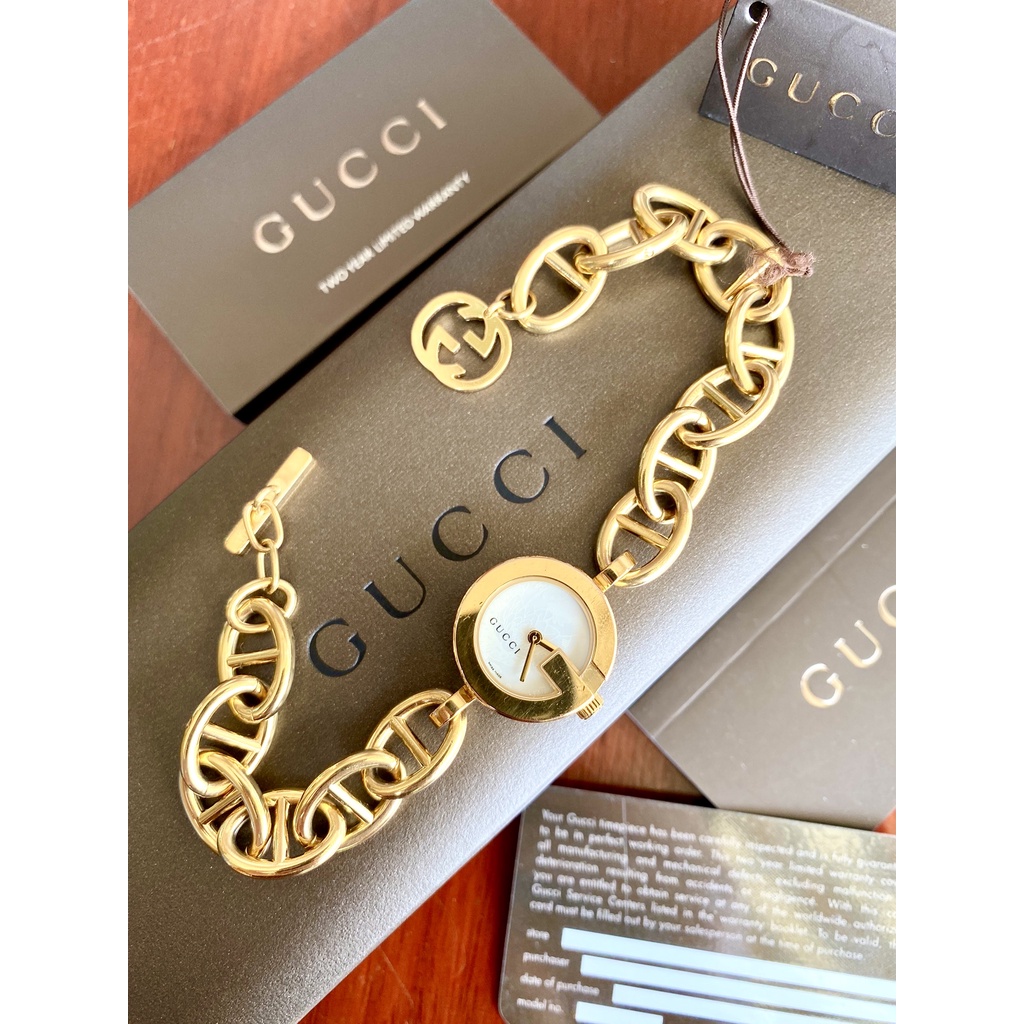 Gucci charm gold plated free size lady watch