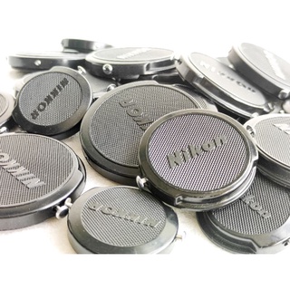 ฝาปิดหน้าเลนส์ ยี่ห้อ Nikon ปุ่มเหล็ก  ขนาด 34.5mm 40.5mm 52mm GENUINEFRONT LENS CAP CHROME BUTTON CLIP ON จากญี่ปุ่น