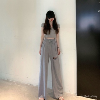 Cicishop(107)เซท 2ชิ้น เสื้อ Crop แขนสั้นสีพื้น + กางเกงขายาว แต่งขาดขากางเกง 1 ข้าง เอวยืดสม็อค kH9L