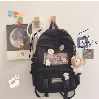 กระเป๋าสะพายหลัง Backpack กระเป๋าเป้ กระเป๋าสะพายหลังมินิมอล กระเป๋าเป้ กระเป๋านักเรียน พร้อมพวงกุญแจตุ๊กตาและเข็มกลัด
