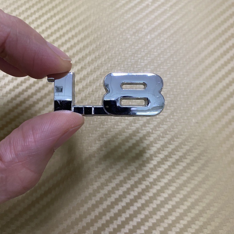โลโก้* ตัวเลข 1.8 สีชุบโครเมี่ยม ขนาด* 1.7 x 4.5 cm ราคาต่อชิ้น