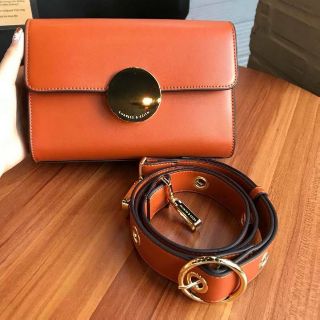 CHARLES &amp; KEITH (ส้มอิฐ/ดำ) CIRCULAR BUCKLE CROSSBODY BAG