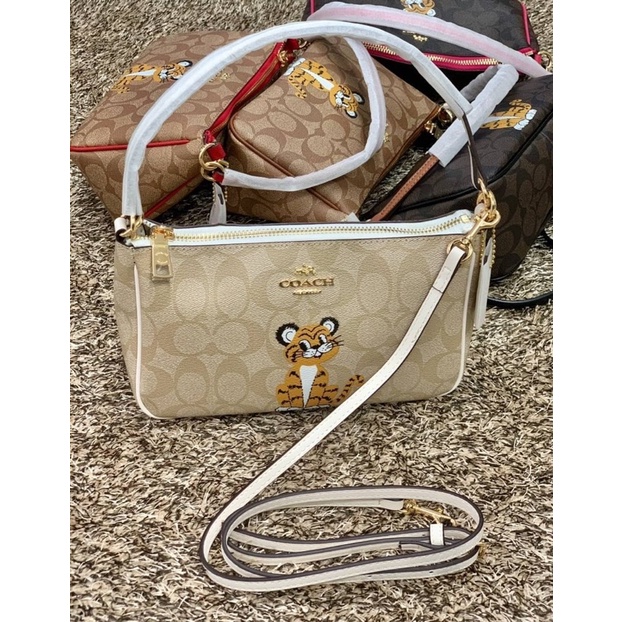 COACH TOP HANDLE POUCH SIGNATURE WITH BABY TIGER PRINT