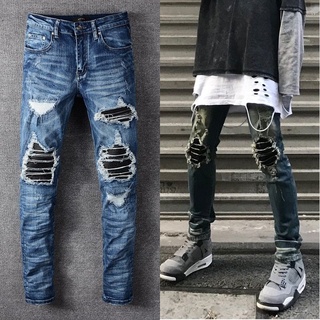 Amiri​​ blue jeans knife cut hole jeans