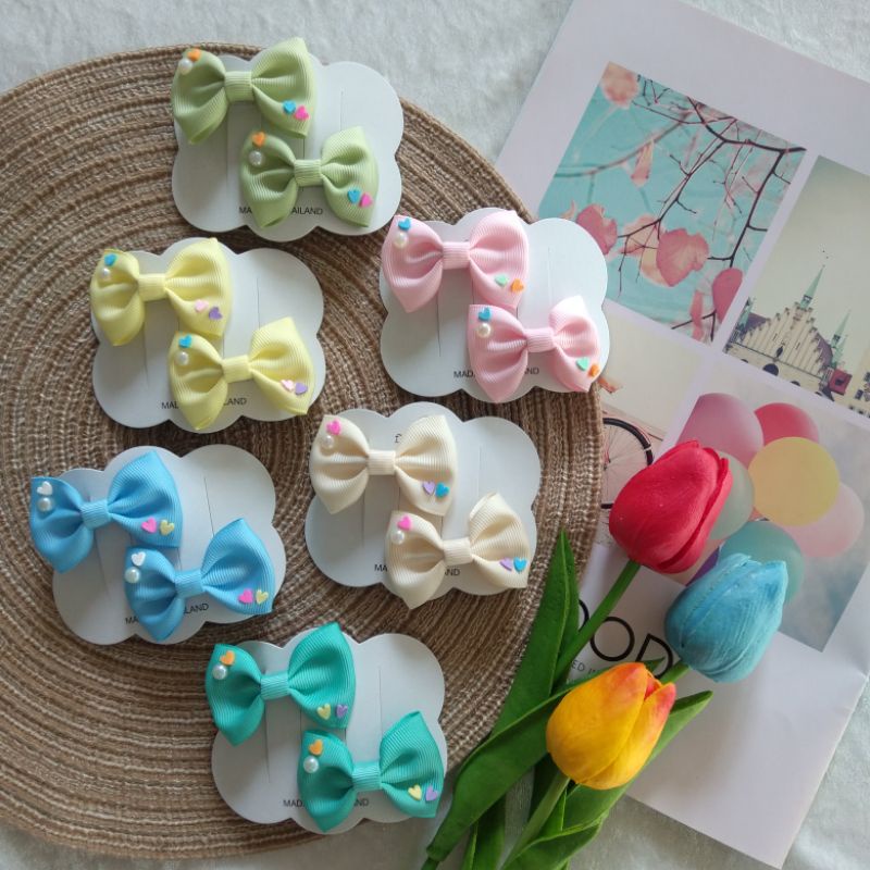 กิ๊บโบว์ติดผมเด็กมินิ5cm. ตกเเต่งหัวใจ(ราคา/1คู่)