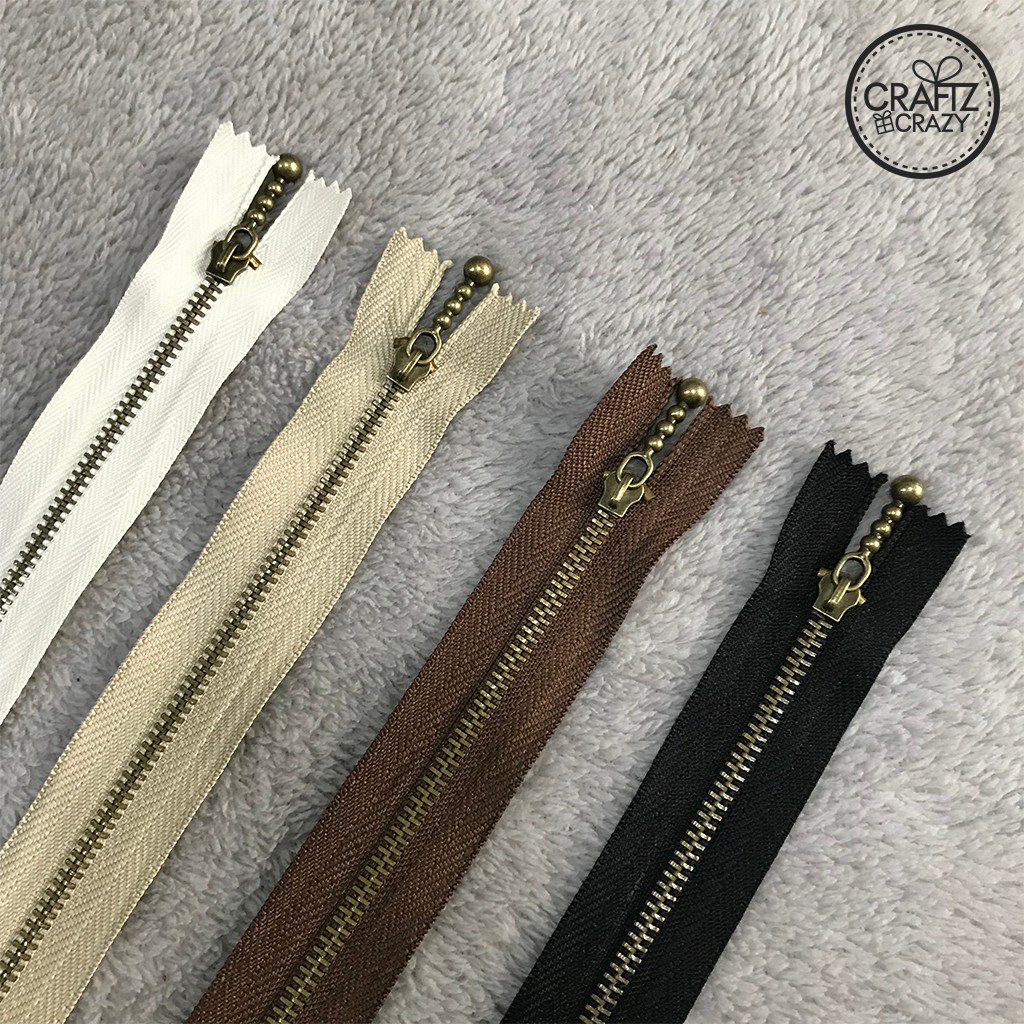 ซิปสำเร็จฟันเหล็ก เบอร์ 3 หัวตุ้มสีทองรมควัน