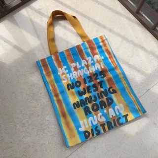 MARNI JC PLAZA, SHANGHAI NO 1225 WEST NANJING ROAD JINGAN DISTRICT BLUE YELLOW STRIPE SHOPPING TOTE BAG กระเป๋ามาร์นี่