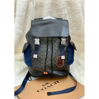 กระเป๋า Coach Rivington Backpack In Signature Canvas With Coach Patch ((79036))