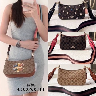 COACH JES BAGUETTE IN BLOCKED SIGNATURE CANVAS