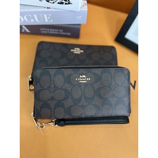 (ผ่อน0%) กระเป๋าสตางค์ LONG ZIP AROUND WALLET IN SIGNATURE CANVAS (COACH C4452) ลายซี สีน้ำตาลเข้ม ซิปรอบ มีสายคล้องมือ