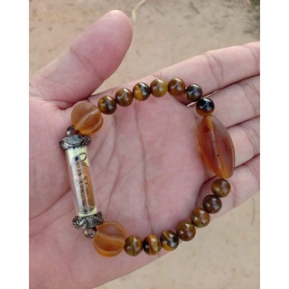 สร้อยข้อมือลูกปัด เครื่องรางแห่งความมงคลแสตมป์ เด็กวัดเจดีย์ นครศรีผ่านการปลุกเสก