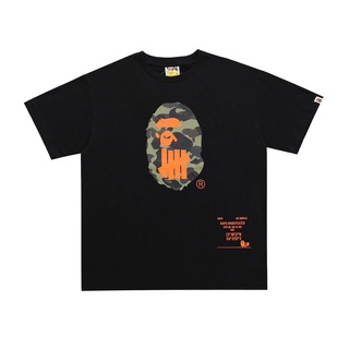 [S-5XL] Undefeated X BAPE limited ape head cool LOGO เสื้อยืดแขนสั้น พิมพ์ลายโลโก้ สําหรับผู้ชาย และผู้หญิง