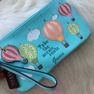 Features &amp; details Wristlet strap with 6" drop 10"W x 5.5"H x 0.75"D