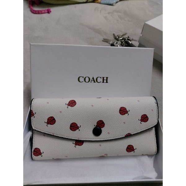 กระเป๋าใบยาวcoachลายเต่าทองสีขาว