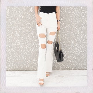 White ripped flare jeans