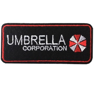 อาร์มปักลาย"UMBRELLA size 7.5x3 cm ปักขาวแดงพื้นดำ ติดเสื้อติดหมวกทหาร ติดสินค้าแฟชั่น งานDIYเสื้อผ้างานปักระเอียด