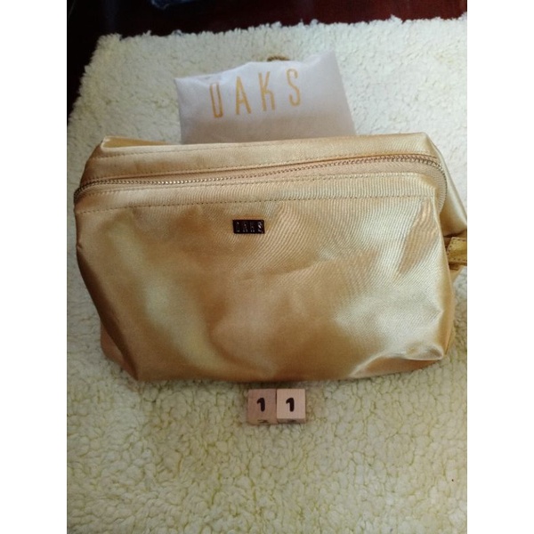 กระเป๋าใส่ของสีทองdaks