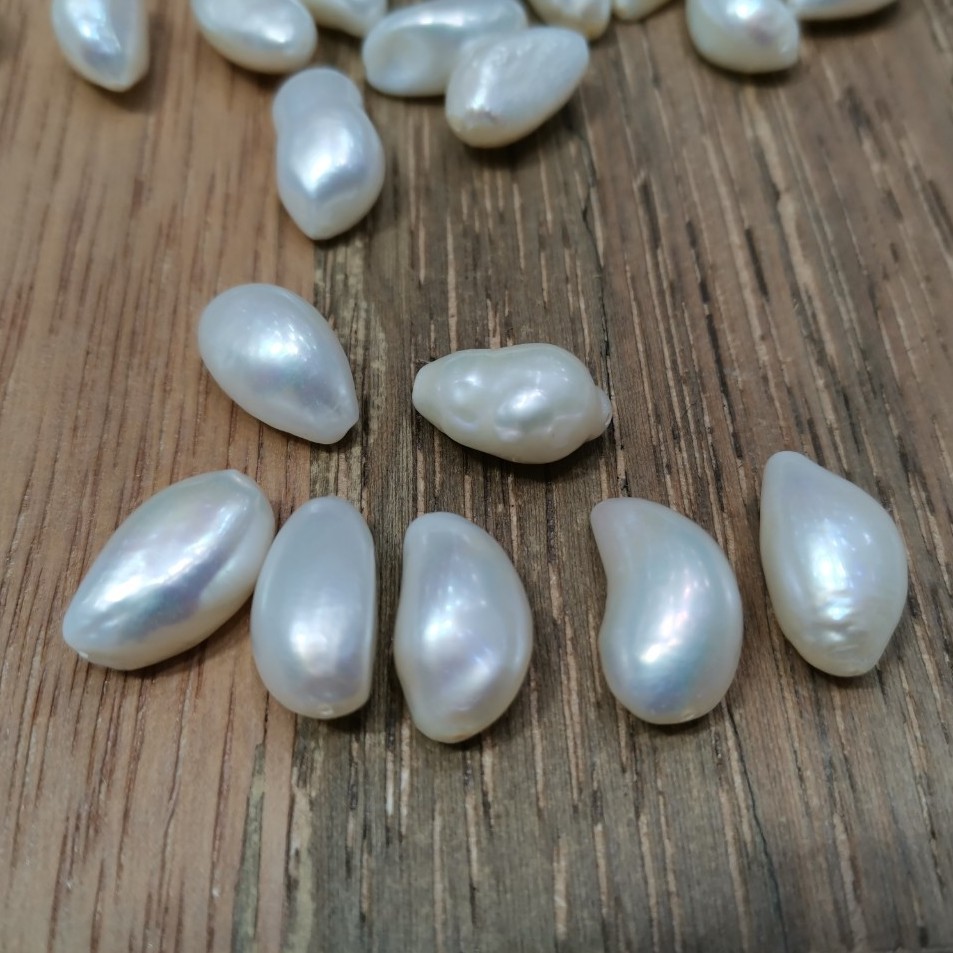 มุกน้ำจืดบาร็อคสีขาว คุณภาพสวยเงา ขนาด 10*16-10*17 มิล มีเจาะ2รู สามารถทำจี้หรือสร้อยคอหรือสร้อยข้อม