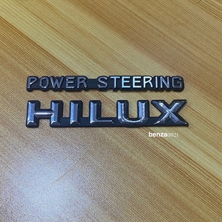 โลโก้ Hilux power steering ติดแก้มข้าง สีเงินขอบดำ ราคาต่อชุดมี 2 ชิ้น