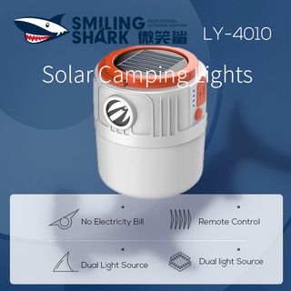 SmilingShark LY-4010 ไฟตั้งแคมป์กลางแจ้ง โคมไฟพลังงานแสงอาทิตย์ ไฟ LED พลังงานแสงอาทิตย์ การชาร์จ USB ไฟ LED แบบพกพา IPX4 สปอร์ตไลท์กันน้ำพร้อมแหล่งกำเนิดแสงคู่ ตะขอควบคุมระยะไกล แขวนอายุการใช้งานแบตเตอรี่ยาวนาน โคมไฟกลางแจ้ง สวน เต็นท์ทำงาน ไฟดับ