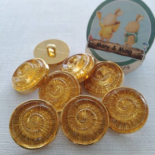กระดุมพลาสติค ลายก้นหอย สี Yellow Topaz ขนาด 25 มิล ราคา 1 เม็ด 12 บาท