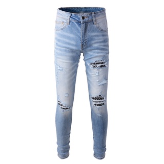 Amiri New Vintage Blue Ripped Patch เม็ดมะม่วงหิมพานต์ Slim Jeans for Men