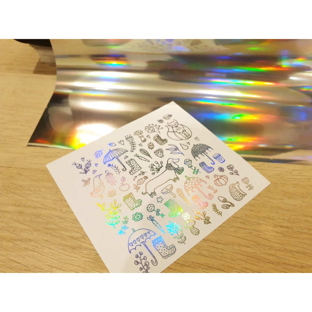 Foil transfer ฟอยล์เคลือบร้อน ชนิดโฮโลแกรม สีเงินเหลือบรุ้ง สำหรับเคลือบบนหมึกเลเซอร์ 32×21cm จำนวน 10แผ่น/แพค