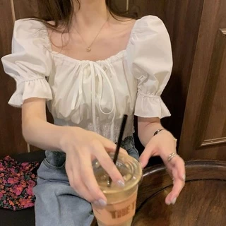 มาใหม่เสื้อครอปเอวลอยเเขนตุ๊กตาผูกโบว์ สีพื้นผ้าลื่น งานสม็อคเอว มี3สีไห้เลือก