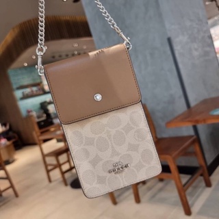 COACH F76357 SNAP PHONE CROSSBODY IN SIGNATURE CANVAS